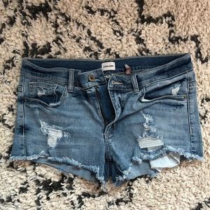Destroyed mid rise denim shorts